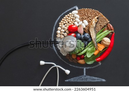 Food products good for health and planet, globe abstraction with stethoscope on chalkboard, planetary health diet concept 
