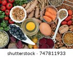 Food to promote brain power and memory concept with nuts, seeds, herbs, vegetables, fruit, dairy and fish. Super foods high in vitamins, antioxidants, omega 3 fatty acids, Immune boosting.