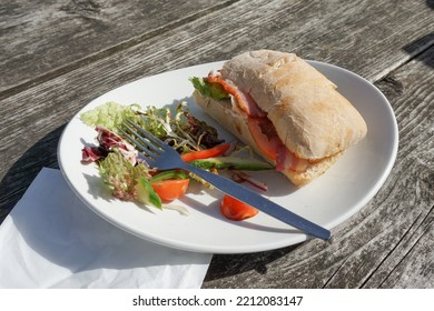 Food In Pub Beer Garden. BLT Sandwich Half Eaten On Plate. Lunch Food Image 