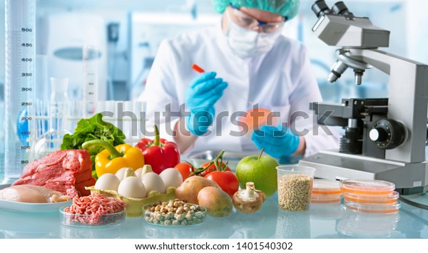 Food quality control expert inspecting\
specimens of groceries in the\
laboratory
