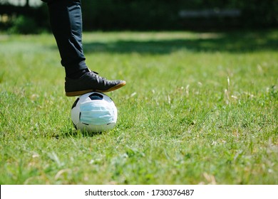 Food Ready To Kick Off Soccer Football With Surgical Face Mask On Natural Turf Grass, Symbol Image For Sports During The Corona Covid-19 Pandemic In 2020