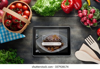 Food Recipes Tablet Computer On Rustic Wooden Table