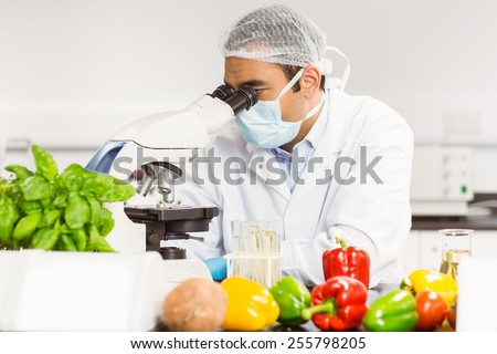 Food scientist using the microscope at the university