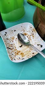 Food Scraps On A Plain White Plate