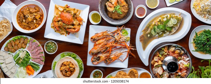 Food. Set of dishes on the table. On a wooden background - Shutterstock ID 1205038174