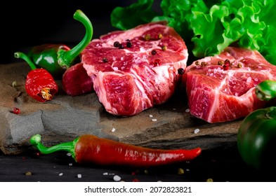 Food Set For A Picnic. Beef Steaks Ribeye Ready To Cook At Barbecue. Two Classic Fresh Ribeye Steak On Stone With Herbs Peppercorns Over Grey Stone Surface Background Top View. Food