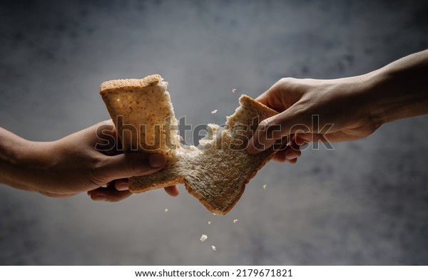 Food Shortage, World Food Crisis Concepts.\
Inflation, Fuel Price and Environmental Impact. Global Issues in\
Agricultural and Climate Change. Hungry People Fighting and Tearing\
for a Bread