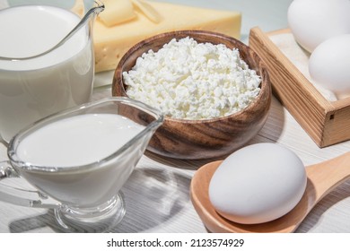 Food is a source of calcium, magnesium, protein, fats, carbohydrates, balanced diet. Dairy products on the table: cottage cheese, sour cream, milk, cheese, chicken egg, contain casein, albumin