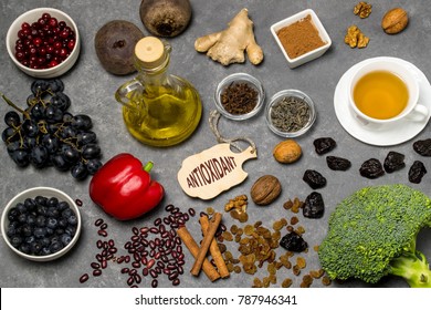 Food Sources Natural Antioxidants. Antioxidants Neutralize Free Radicals, Have Beneficial Health Effects. Group Includes Minerals, Carotenoids And Vitamins. Small Board With Word Antioxidant. Top View