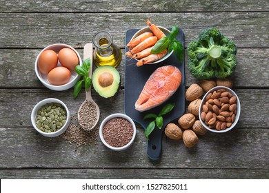 Food sources of omega 3 and healthy fats. Foods high in fatty acids including seafood, vegetables, nut and seedsTop view 