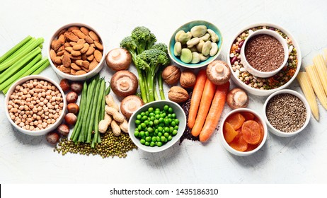 Food sources of plant based protein. Healthy diet with  legumes, dried fruit, seeds, nuts and vegetables.  Foods high in protein, antioxidants, vitamins and fiber.