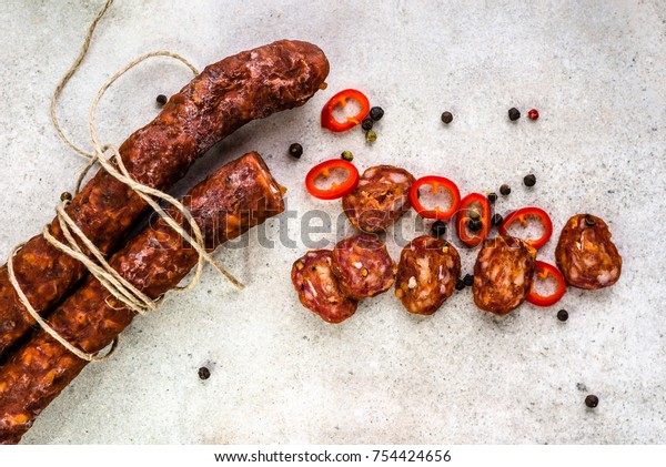 Food from spain, chorizo sausage\
slices or salami pepperoni, traditional spanish tapas,\
overhead.