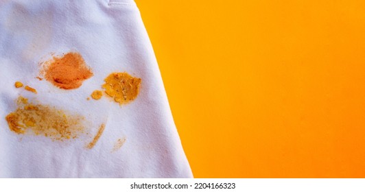 Food Stains On Shirt. Top View Soup Dirt On White Shirt. Space For Text.