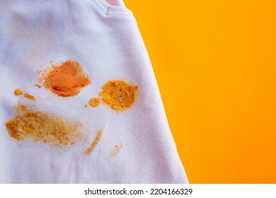 Food Stains On Shirt. Top View Soup Dirt On White Shirt. Space For Text.