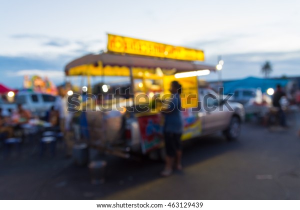 Food Stall or Mobile\
Pickup Food Shop in Market Fair or Local Night Market, Blur or\
Defocus Background