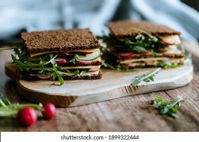 Food still life, fresh whole grain bread with cheese, radish, cucumber, arugula, healthy food, superfood - Powered by Shutterstock