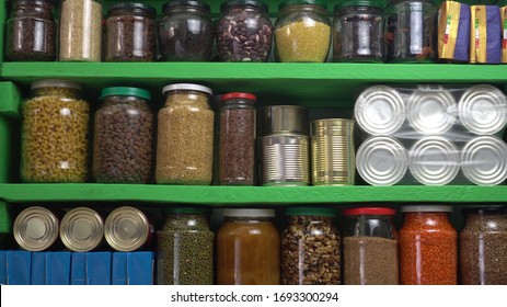 Food Stock Storage Shelf. Stocked Home Pantry Ready For Coronavirus Quarantine And Self-isolation. Long Storage Foods, Drinks, Supplies. Dry Beans, Rice, Pasta, Nuts, Seeds, Canned Goods And Vegetable