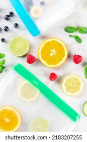 Food Storage Bags With Fresh Fruit And Vegetables, Top Shot On A White Marble Background. Summer Harvest In Ziplock Containers