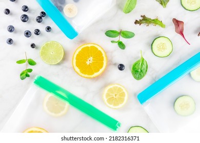 Food Storage Bags With Fresh Summer Fruit And Vegetables, Shot From Above On A White Marble Kitchen Table. Summer Produce In Zip Lock Containers