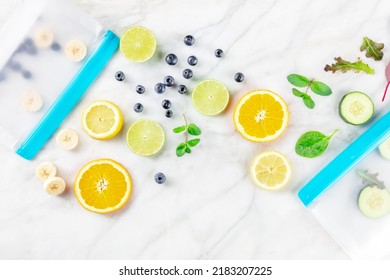 Food Storage Bags With Fresh Summer Fruit And Vegetables, Shot From Above On A White Marble Kitchen Table. Summer Salad In Zip Lock Containers