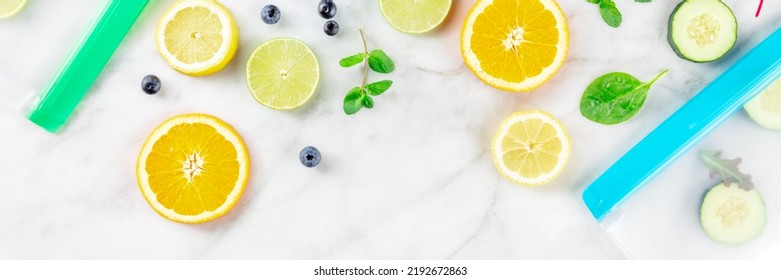 Food Storage Bags Panorama With Fresh Fruit And Vegetables, Top Shot On A White Marble Kitchen Table. Summer Produce In Ziplock Containers