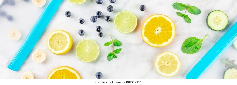 Food Storage Bags Panorama With Fresh Fruit And Vegetables, Top Shot On A White Marble Background. Summer Snacks In Ziplock Containers