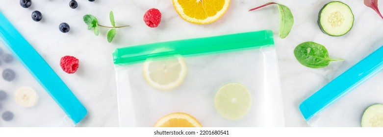 Food Storage Bags Panorama With Fresh Fruit And Vegetables, Top Shot On A White Marble Background. Summer Harvest In Ziplock Containers