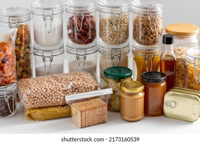 Food Storage And Eating Concept - Close Up Of Different Cereals, Groceries And Preserves On Table