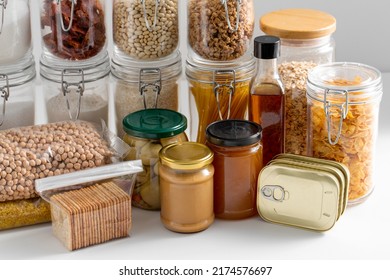 Food Storage And Eating Concept - Close Up Of Different Cereals, Groceries And Preserves On Table