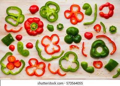 Food styling image design of red and green bell pepper slices on white wooden cutting board. - Powered by Shutterstock