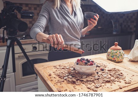 Food styling for food photography shooting on camera. Food vlogger shooting video in the kitchen. Foodstyling, preparing food for the camera, healthy eating work from home Stock photo © 