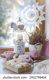 Food styling for saint Valentine's Day with wooden heart, zephyr, meringue, flowers and wooden decor