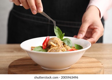 Food Stylist Use Tweezers Decorating Thai Food In White Dish