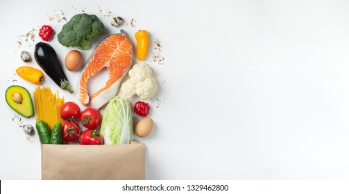 Food From The Supermarket. Paper Bag Full Of Healthy Food. Top View With Copy Space. Flat Lay.