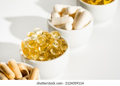 Food supplement oil filled fish oil, omega 3, omega 6, omega 9, vitamin A, vitamin D, vitamin E, flaxseed oil. - Shutterstock ID 2124359114