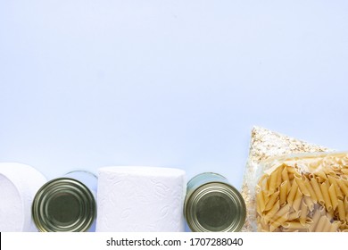 Food supplies crisis food stock for quarantine isolation period on blue background. Rice, pasta, oatmeal, canned food, sugar, toilet paper. Food delivery, Donation, coronavirus quarantine. Copyspace. - Shutterstock ID 1707288040