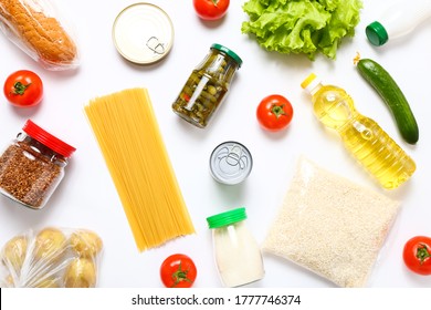 Food supplies on white background. Set of grocery items from canned food, vegetables, pasta, cereal. Food delivery concept. Donation concept. Top view. - Shutterstock ID 1777746374