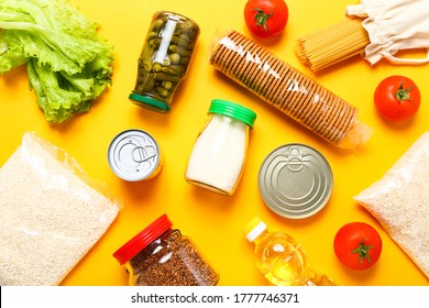 Food supplies on yellow background. Set of grocery items from canned food, vegetables, pasta, cereal. Food delivery concept. Donation concept. Top view. - Shutterstock ID 1777746371