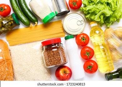 Food supplies for the period of quarantine on white background. Set of grocery items from canned food, vegetables, pasta, cereal. Food delivery concept. Donation concept. Top view. - Shutterstock ID 1723240813