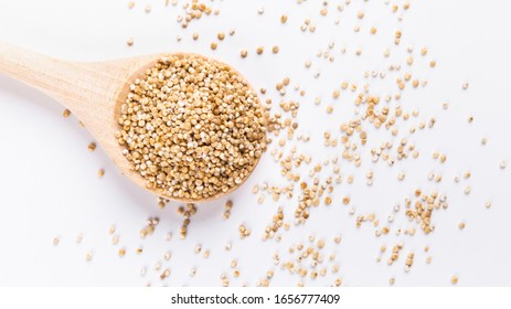 Food Swap. White Quinoa In Round Wooden Spoon Close Up, Free Space