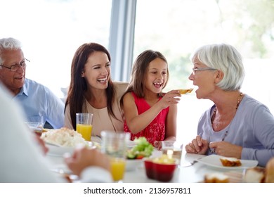 Food Tastes Better When You Eat It With Family. Shot Of A Happy Multi-generational Family Having A Meal Together.