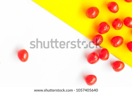 Similar – Foto Bild Frische Himbeeren auf gelbem und rotem Hintergrund