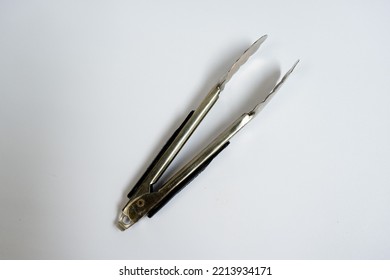 Food Tongs Made From Stainless. Isolated In White Background