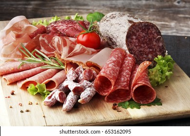 Food Tray With Delicious Salami, Pieces Of Sliced Ham, Sausage, Tomatoes, Salad And Vegetable - Meat Platter With Selection