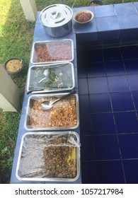 The food is in a tray and there is plastic covered