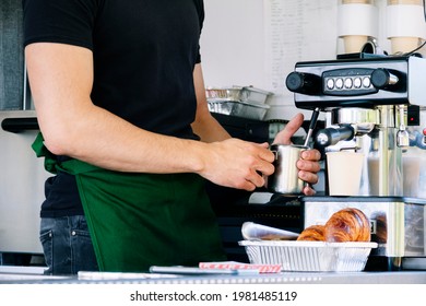 Food truck concept. Man preparing coffee in a small coffee pot. - Powered by Shutterstock