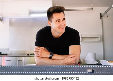 Food truck concept. Waiter looking to the left of him. - Powered by Shutterstock