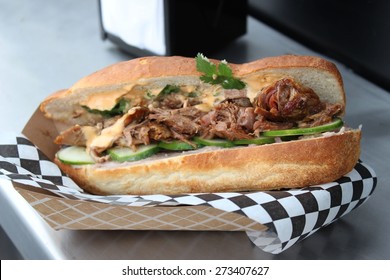 Food Truck gourmet pulled Pork sandwich using artisan bread