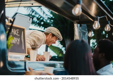 Food Truck Seller Laughing At Joke Of Customers