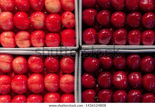 Food. Type of ripe sweet cherry in a package that\
is divided into four\
cells.